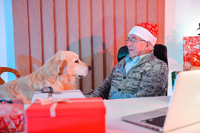 Senior men with his dog christmastime